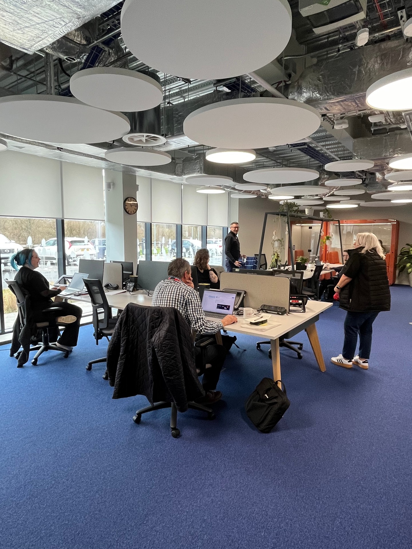 A group of people working together in the Goldworks co-working space.
